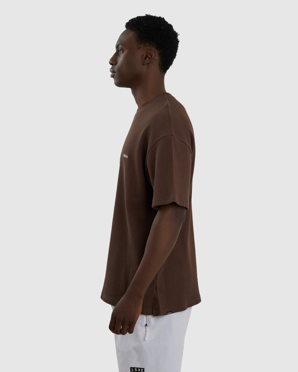 Model wearing Unisex Verse Waffle Tee - Walnut