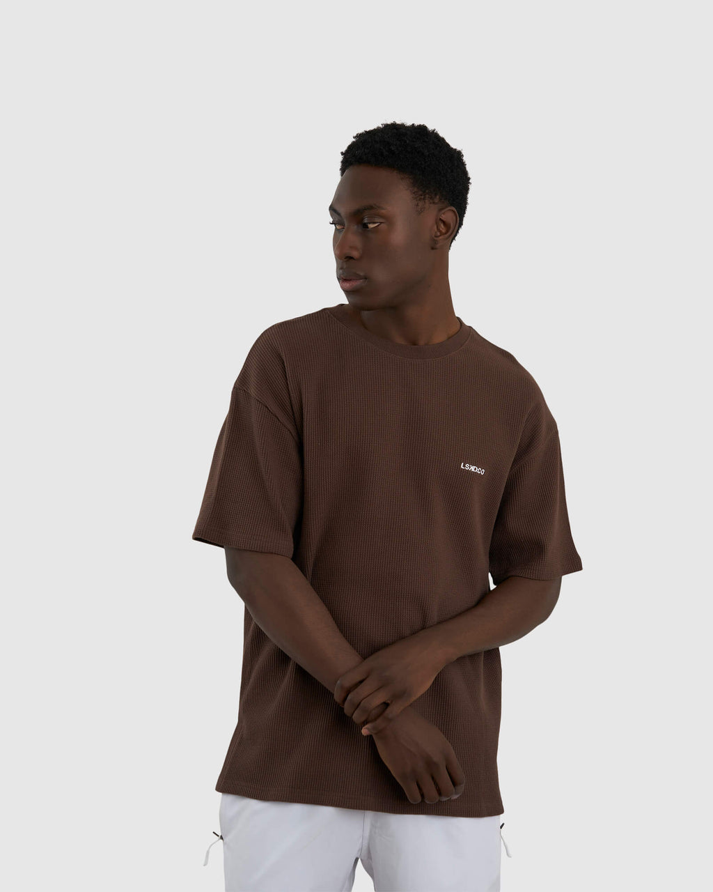 Model wearing Unisex Verse Waffle Tee - Walnut