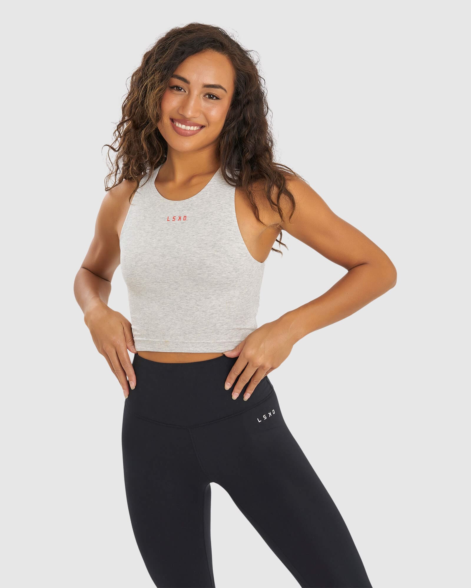 Model wearing Status Tank - Lt Grey Marl- Fruit Punch