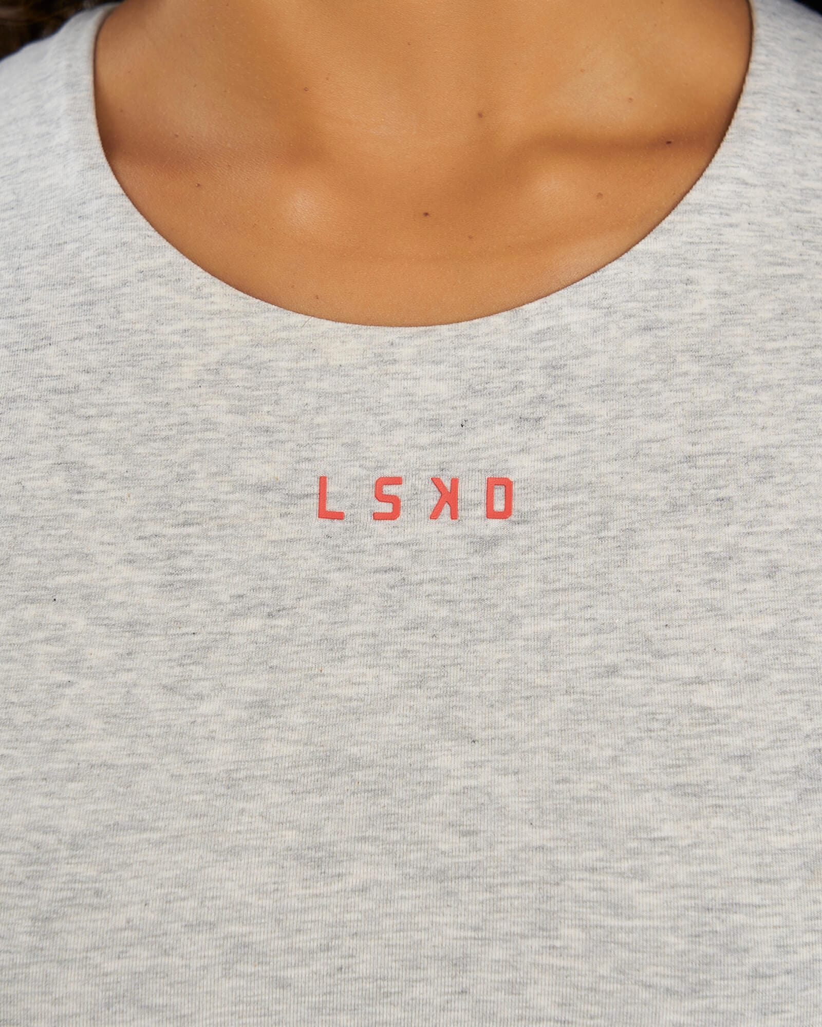 Model wearing Status Tank - Lt Grey Marl- Fruit Punch