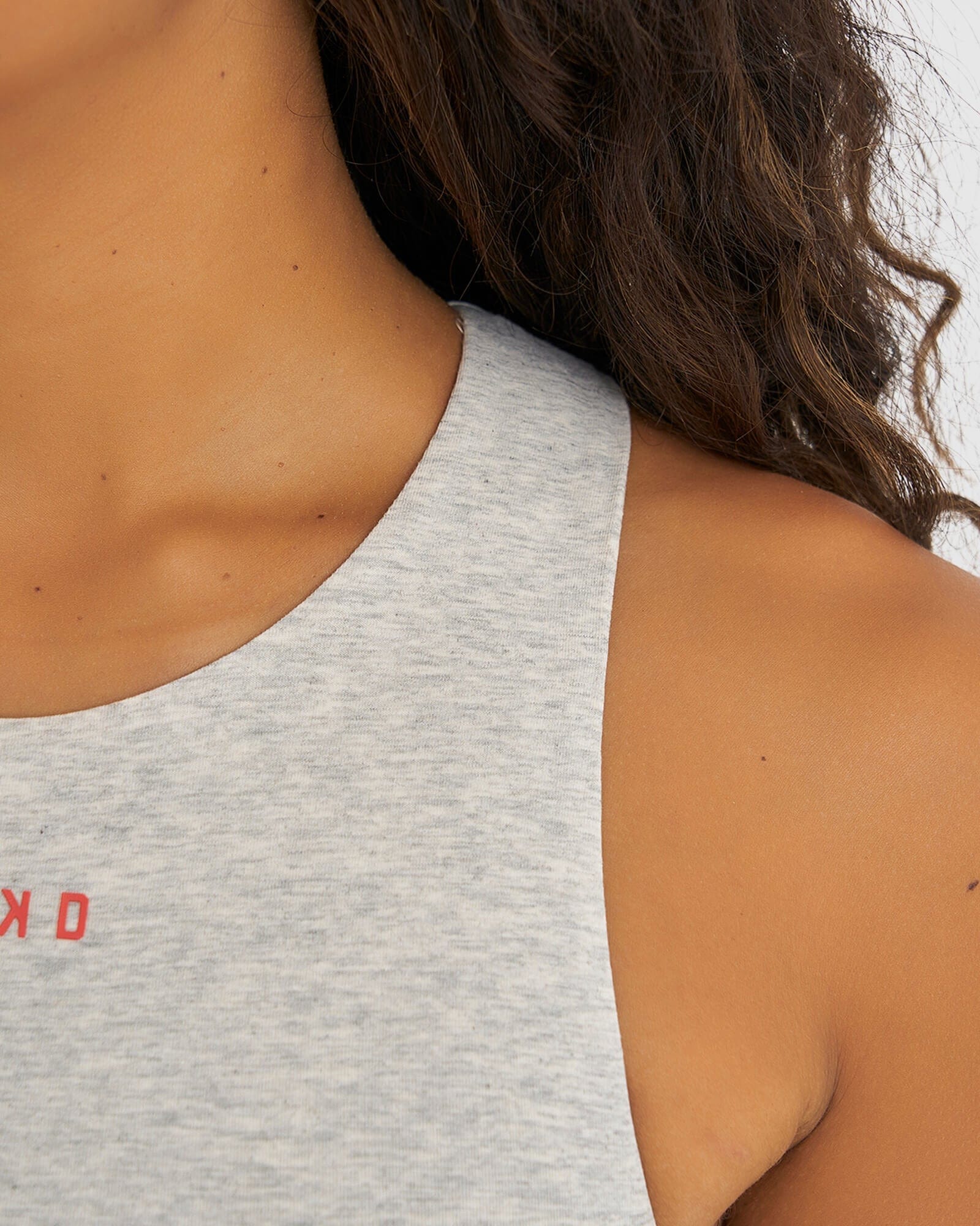 Model wearing Status Tank - Lt Grey Marl- Fruit Punch