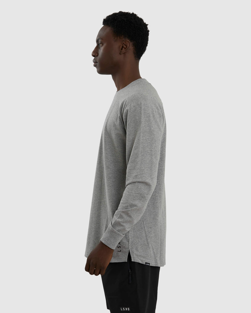 Model wearing Tab LS Tee - Lt Grey Marl