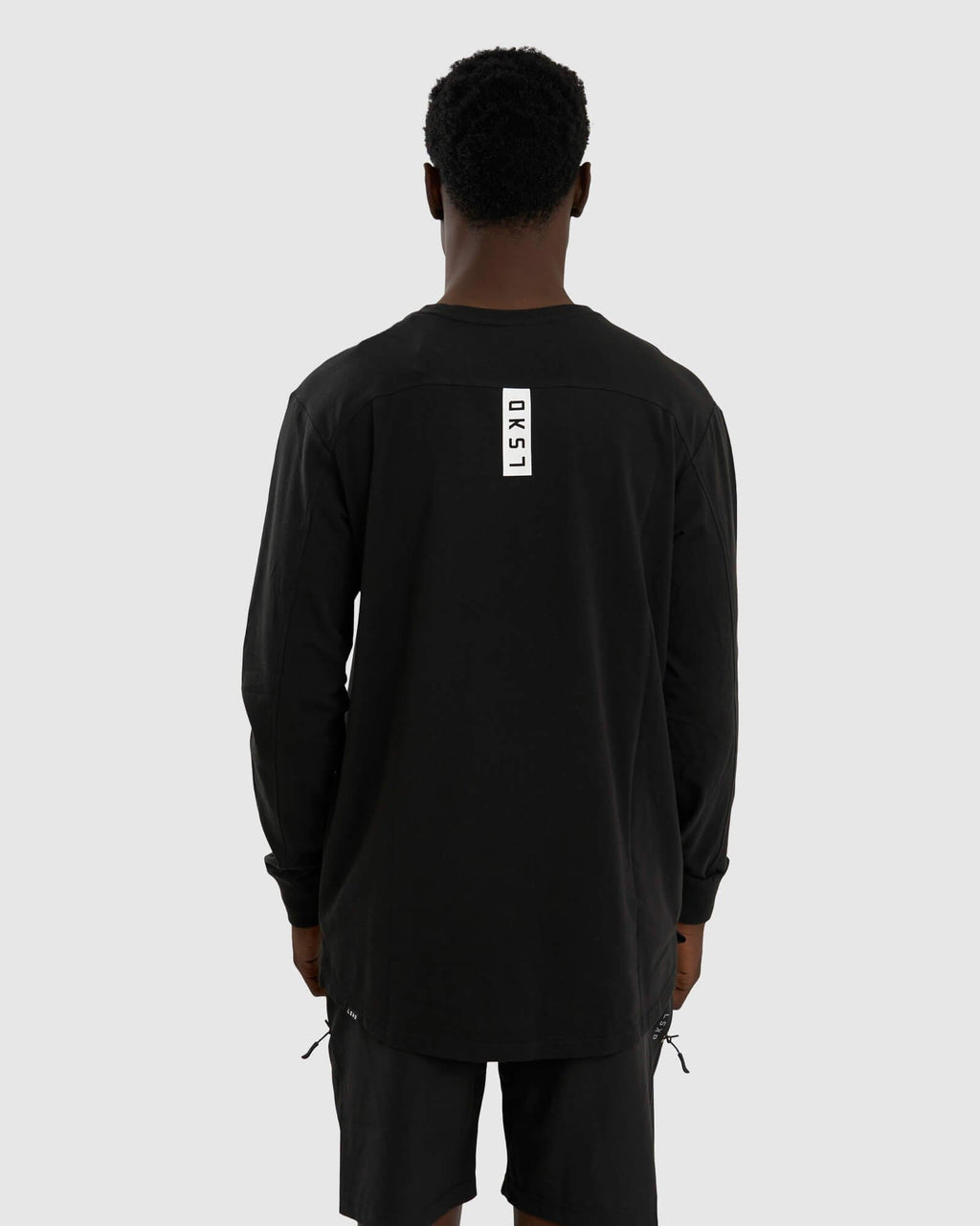 Model wearing Tab LS Tee - Black