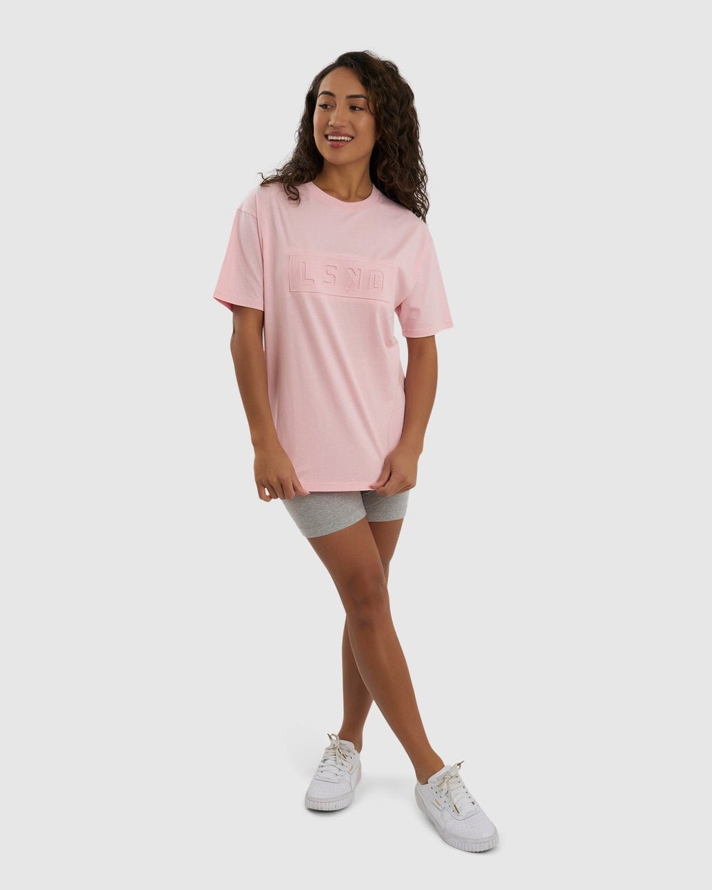 Model wearing Unisex Imprint Tee Oversize - Petal Pink