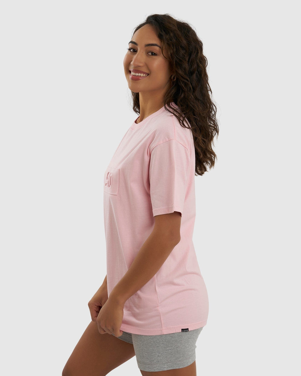 Model wearing Unisex Imprint Tee Oversize - Petal Pink