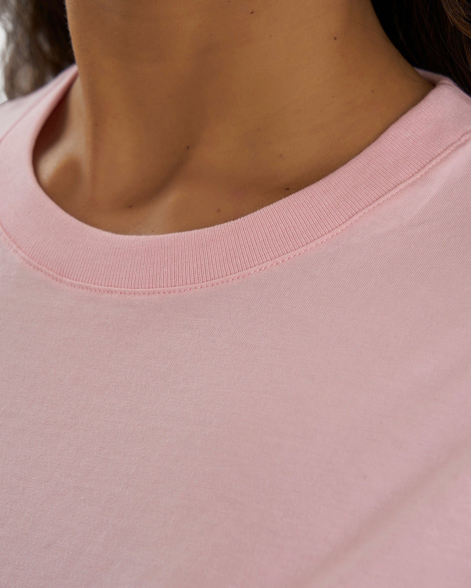 Model wearing Unisex Imprint Tee Oversize - Petal Pink