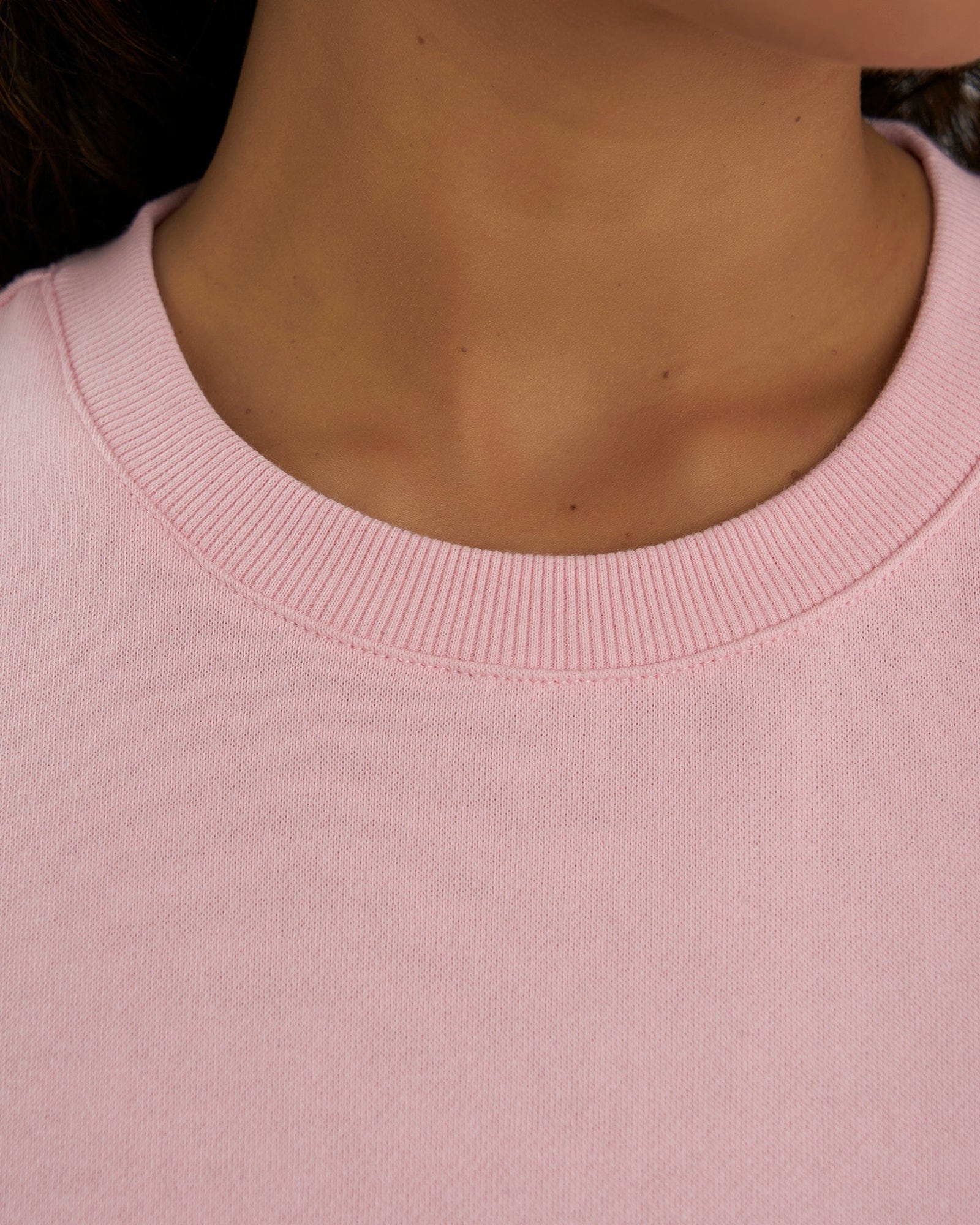 Model wearing Unisex Imprint Sweater - Petal Pink