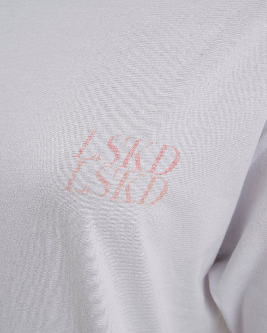 Model wearing Unisex Aurora Tee Oversized - White