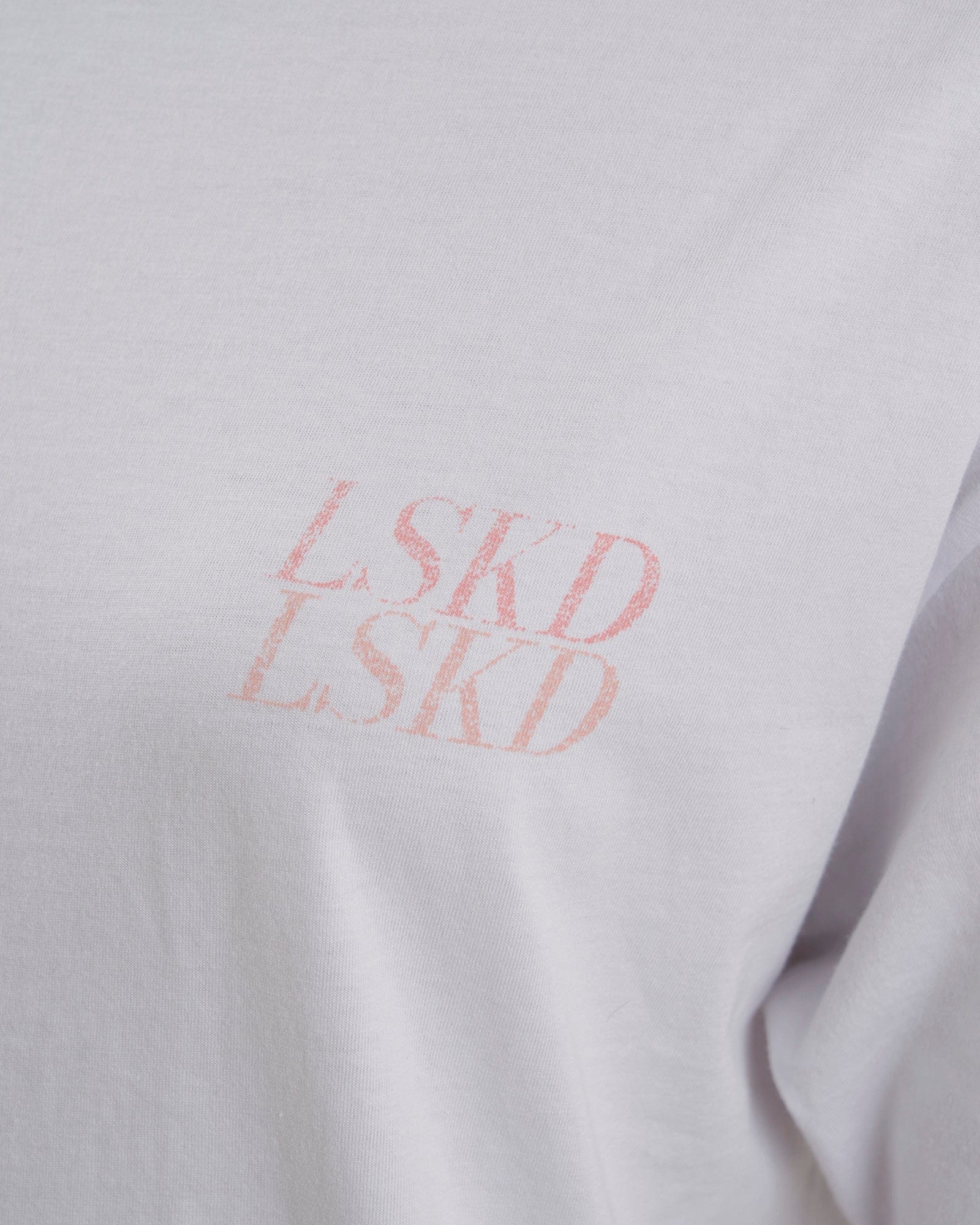 Model wearing Unisex Aurora Tee Oversized - White