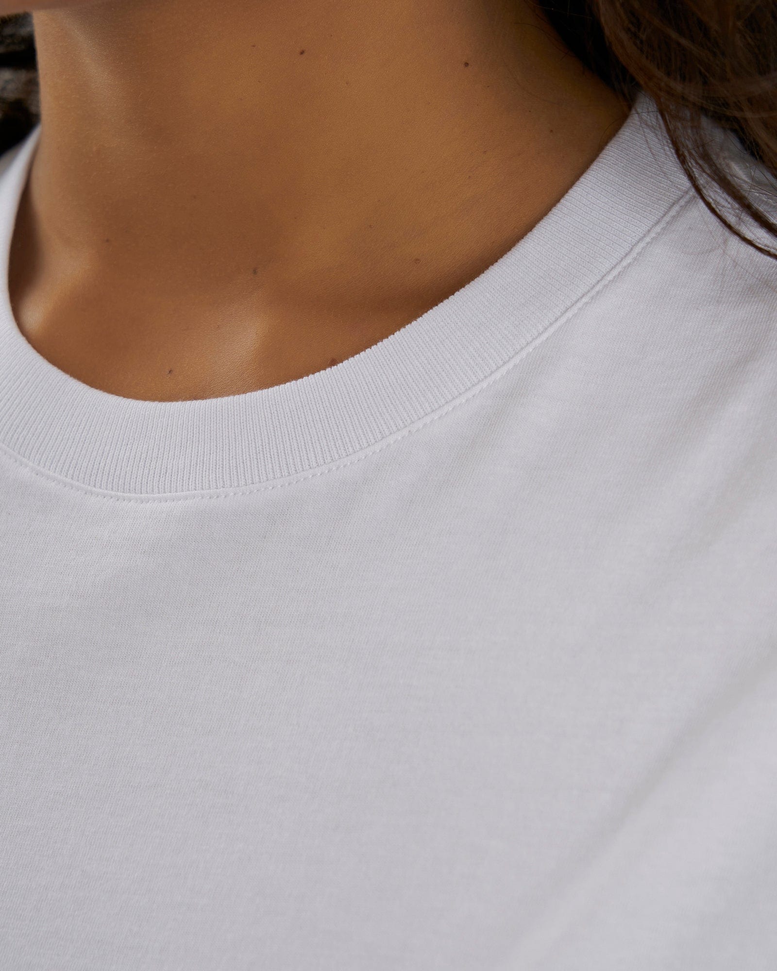 Model wearing Unisex Aurora Tee Oversized - White