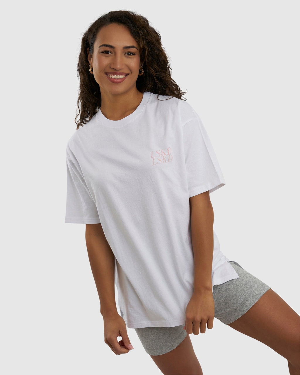 Model wearing Unisex Aurora Tee Oversized - White