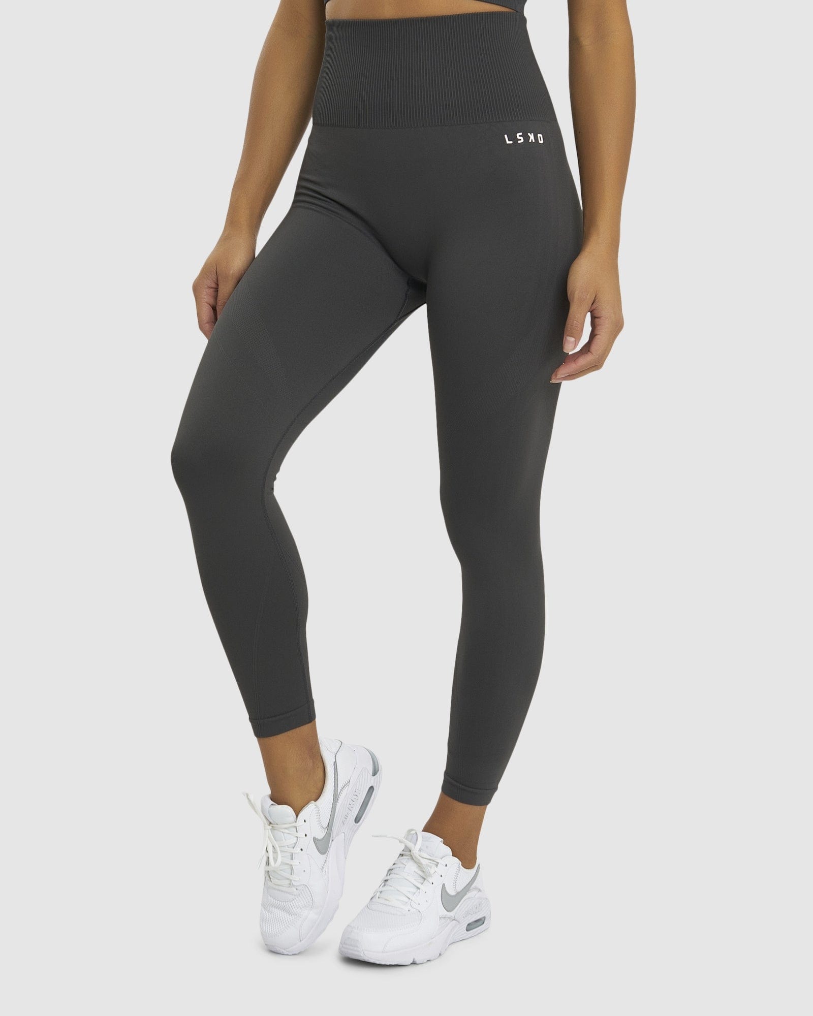 Model wearing Limitless Seamless 7/8 Length Tights - Charcoal