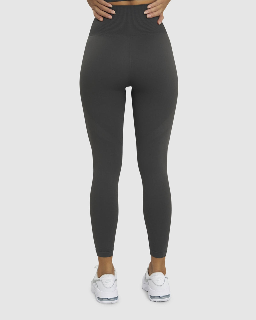 Model wearing Limitless Seamless 7/8 Length Tights - Charcoal