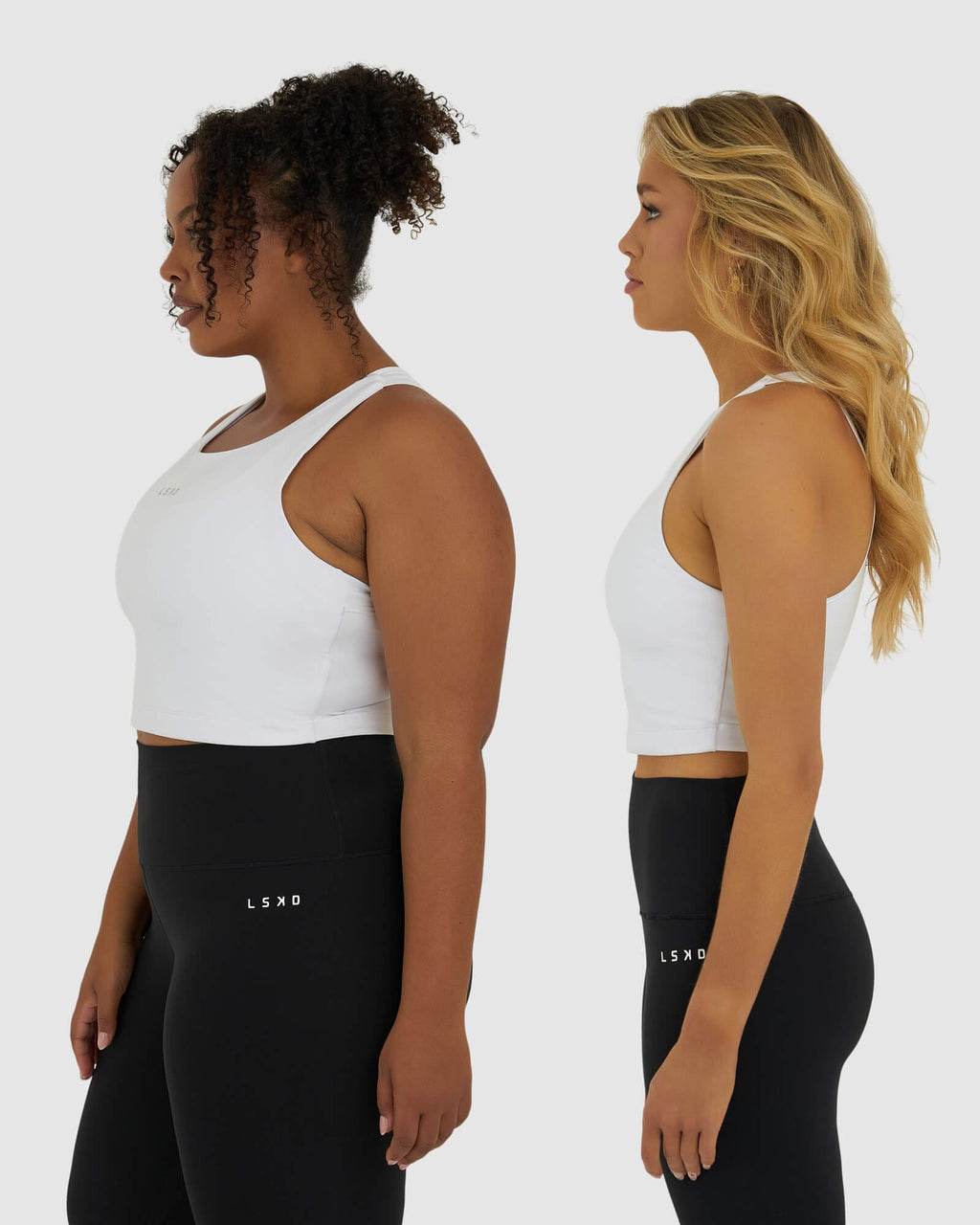 Model wearing Base Crop Tank - White