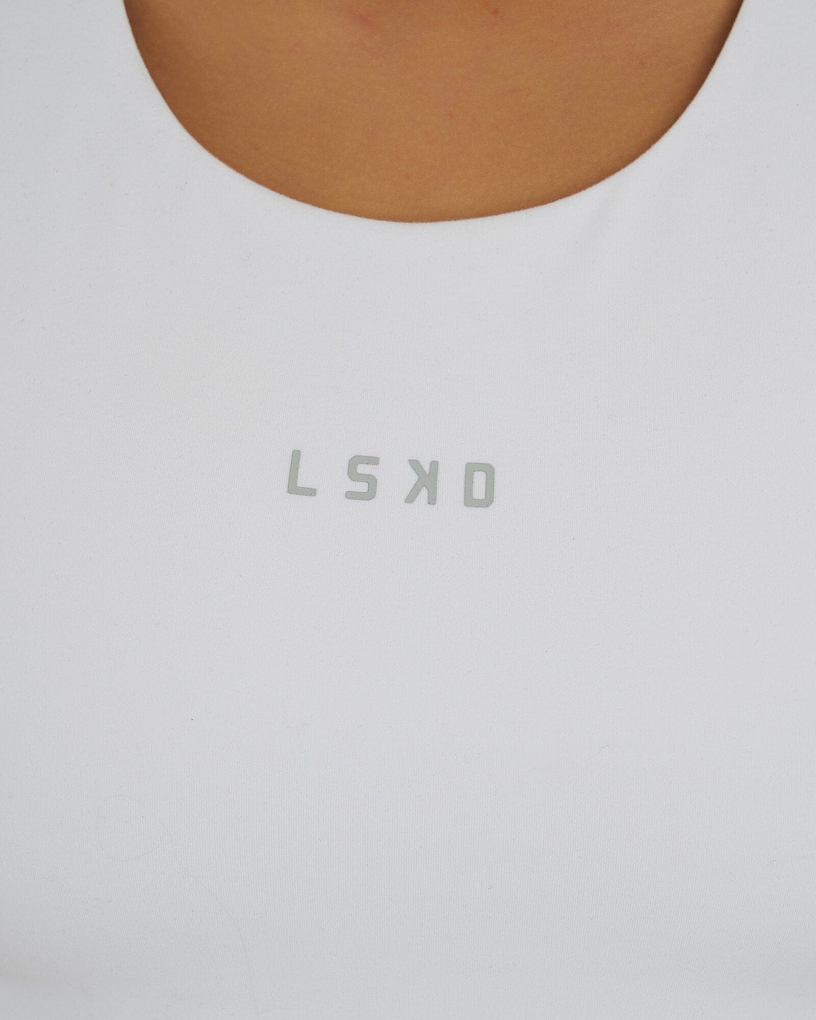 Model wearing Base Crop Tank - White