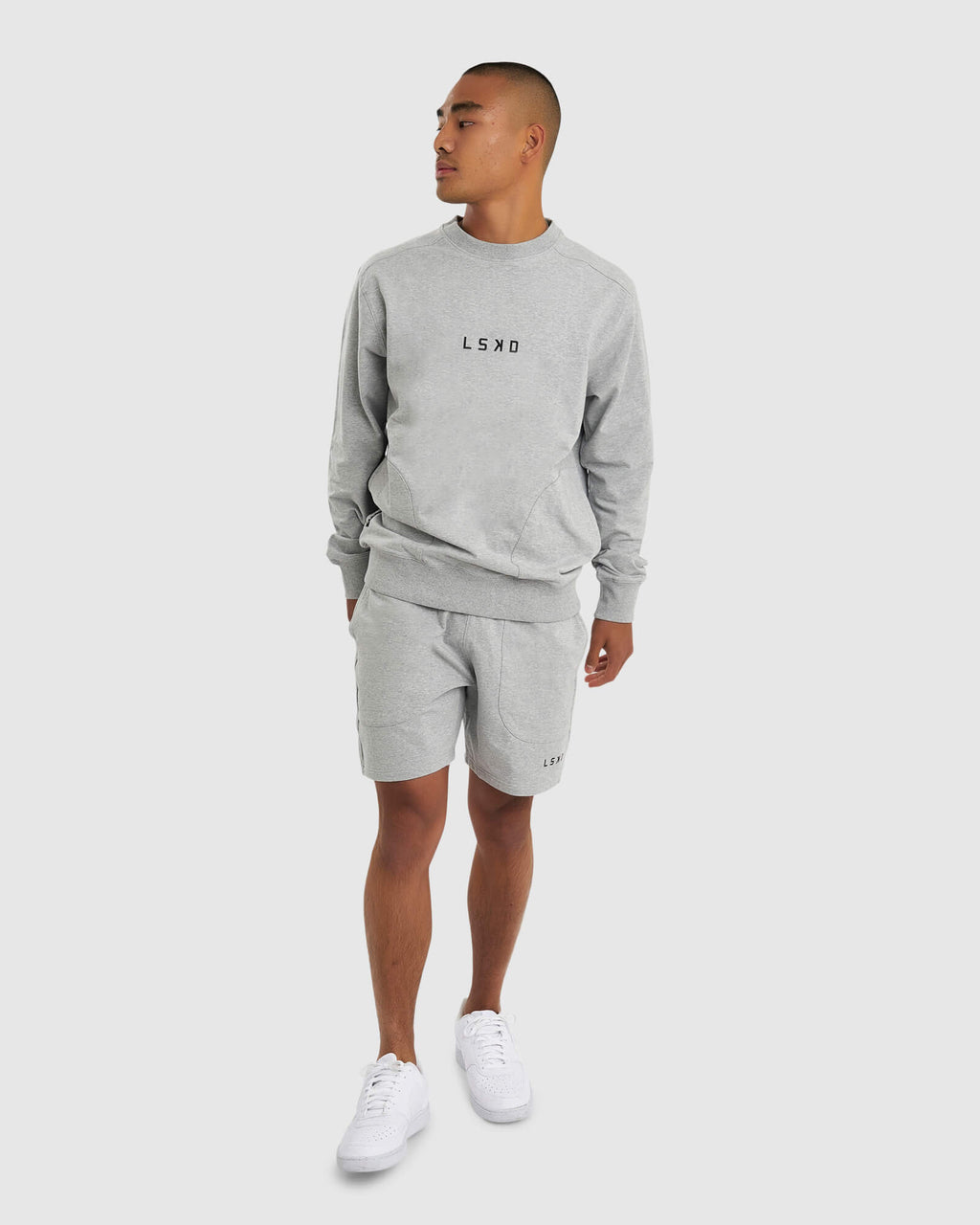 Model wearing Routine Track Short - Light Grey Marl