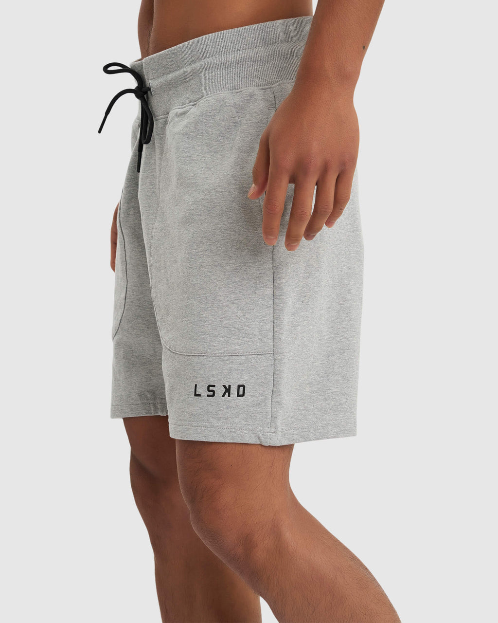 Model wearing Routine Track Short - Light Grey Marl