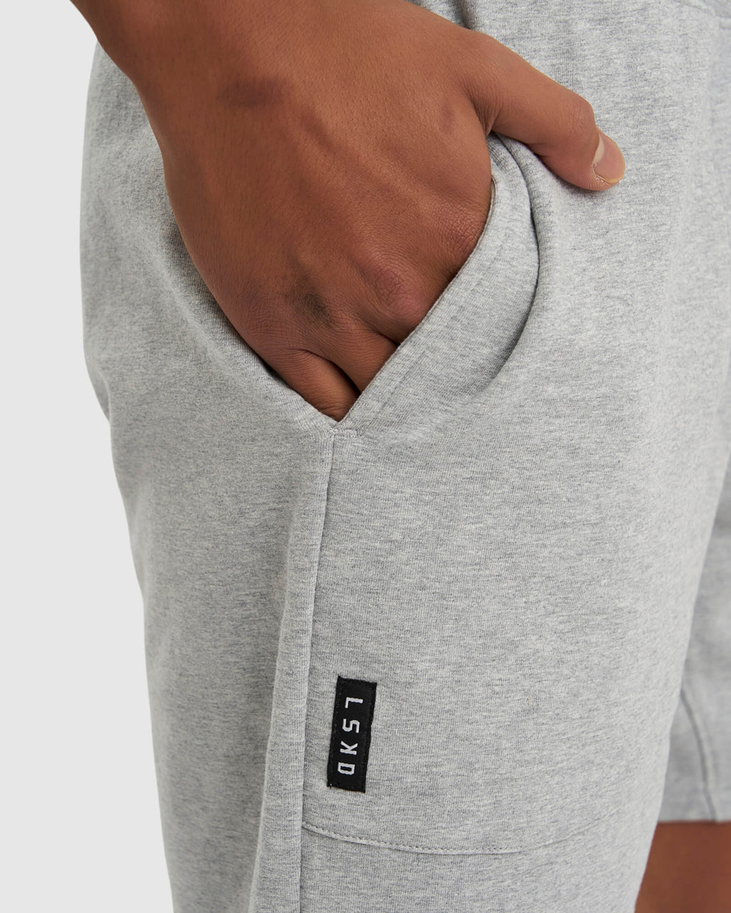 Model wearing Routine Track Short - Light Grey Marl