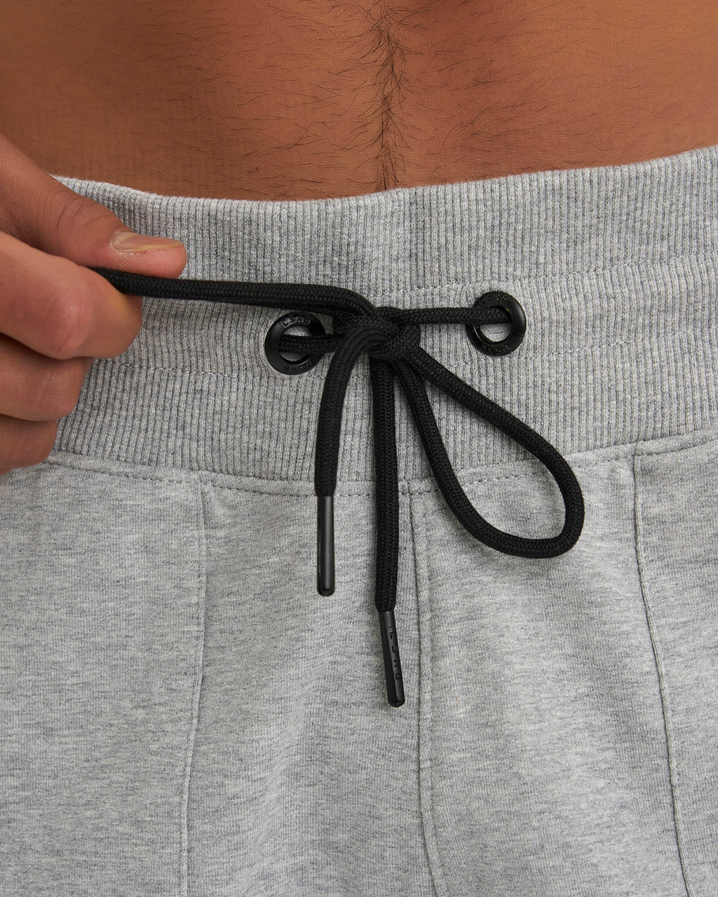 Model wearing Routine Track Short - Light Grey Marl