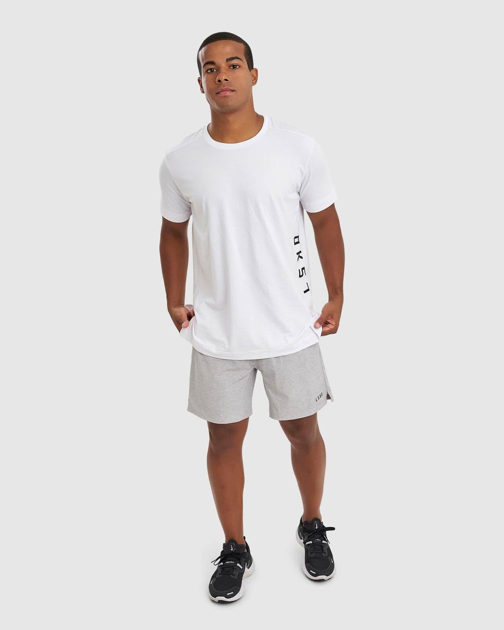 Model wearing Intensity 7" Performance Short - Lt Grey Marl