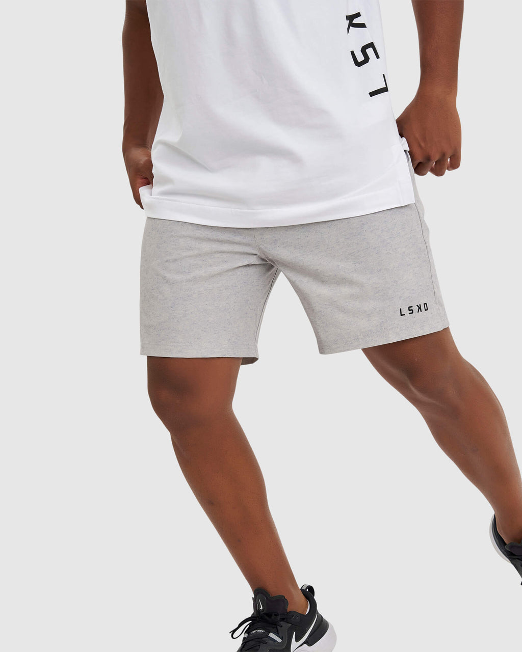 Model wearing Intensity 7" Performance Short - Lt Grey Marl