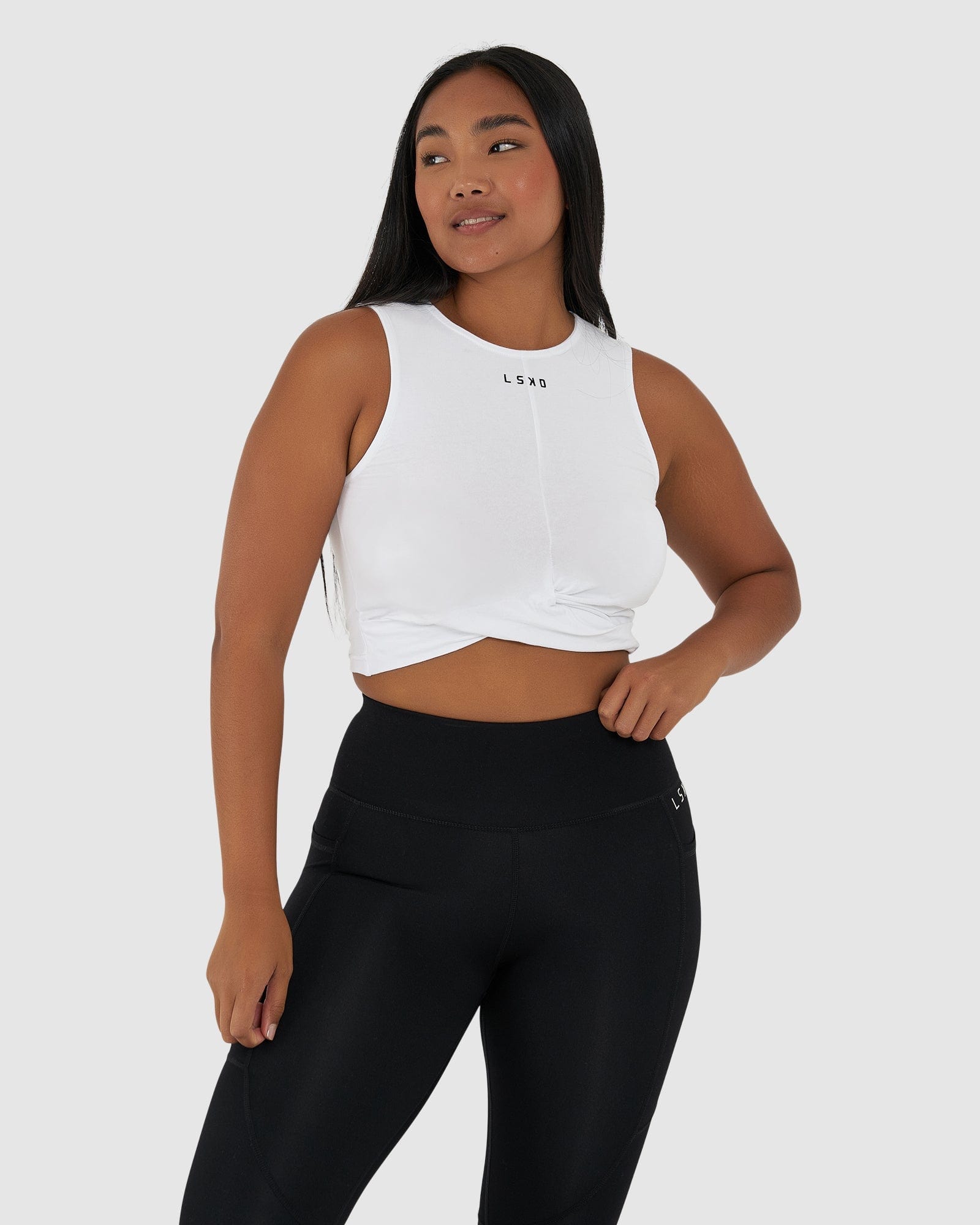 Model wearing Twist Tank - White
