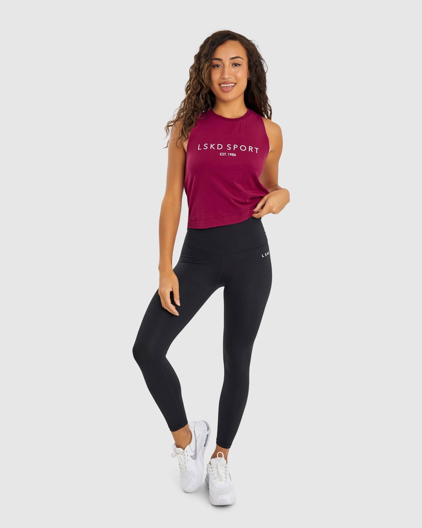 Model wearing Penalty Tank - Candy Apple