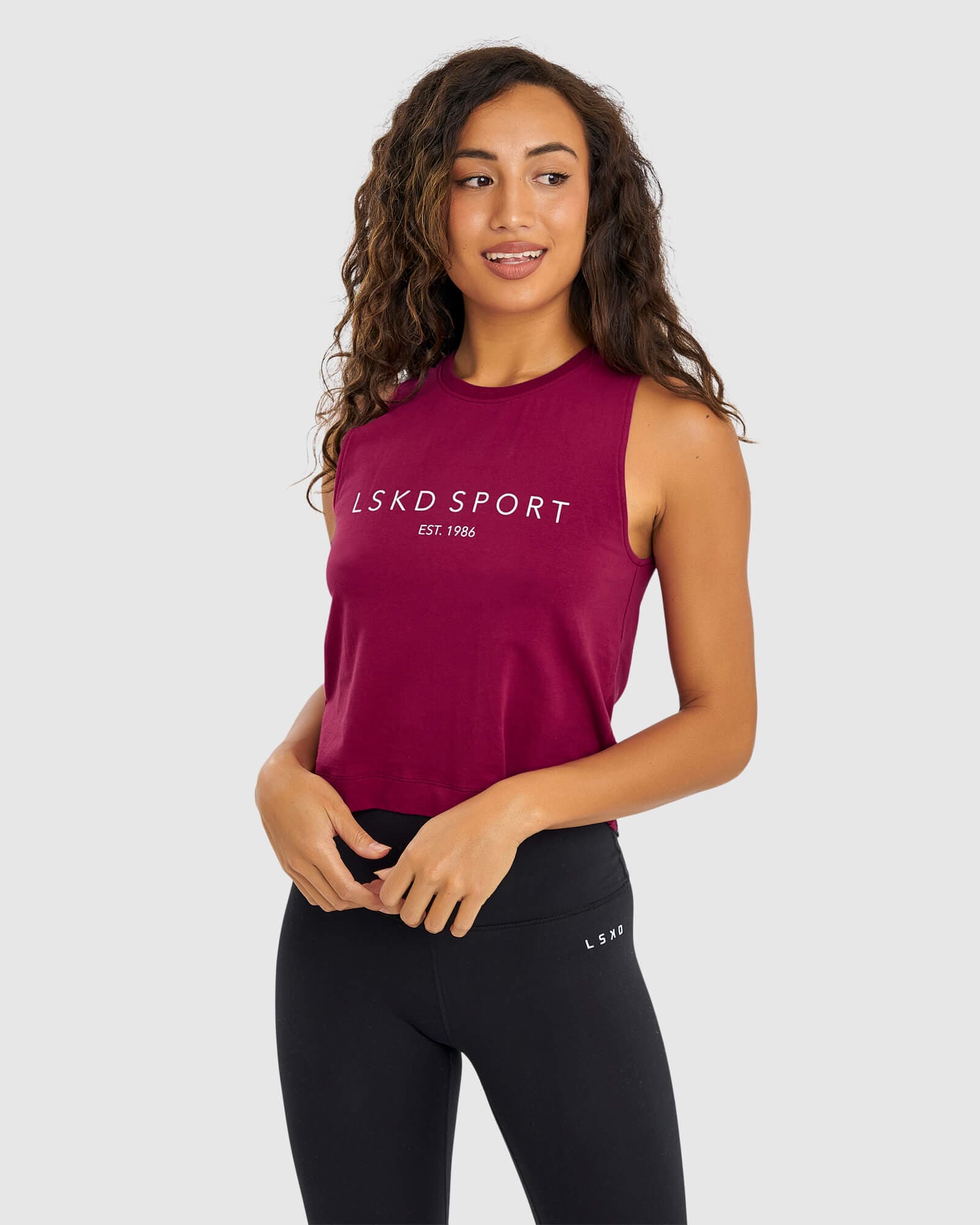 Model wearing Penalty Tank - Candy Apple