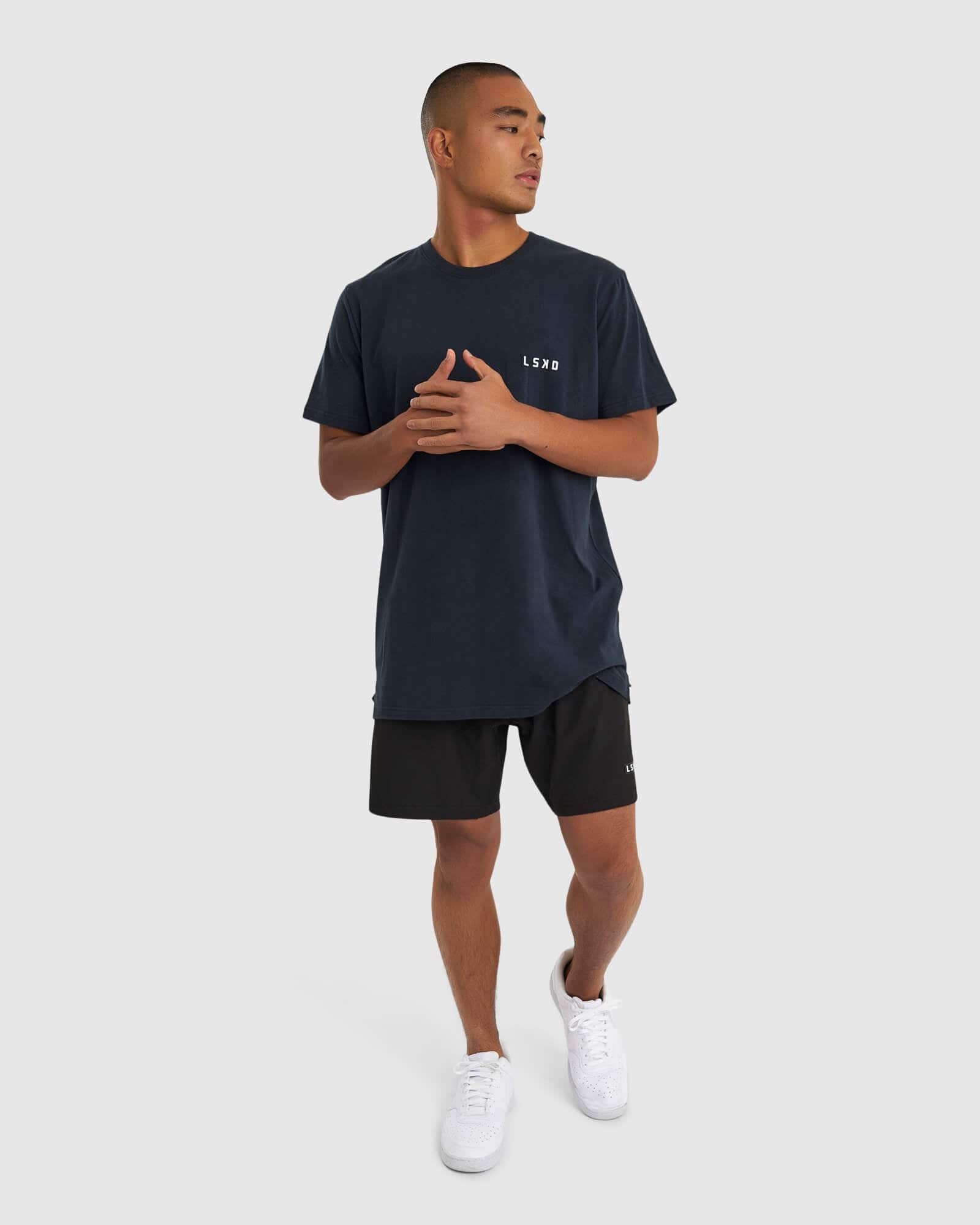 Model wearing Form Tee - Carbon