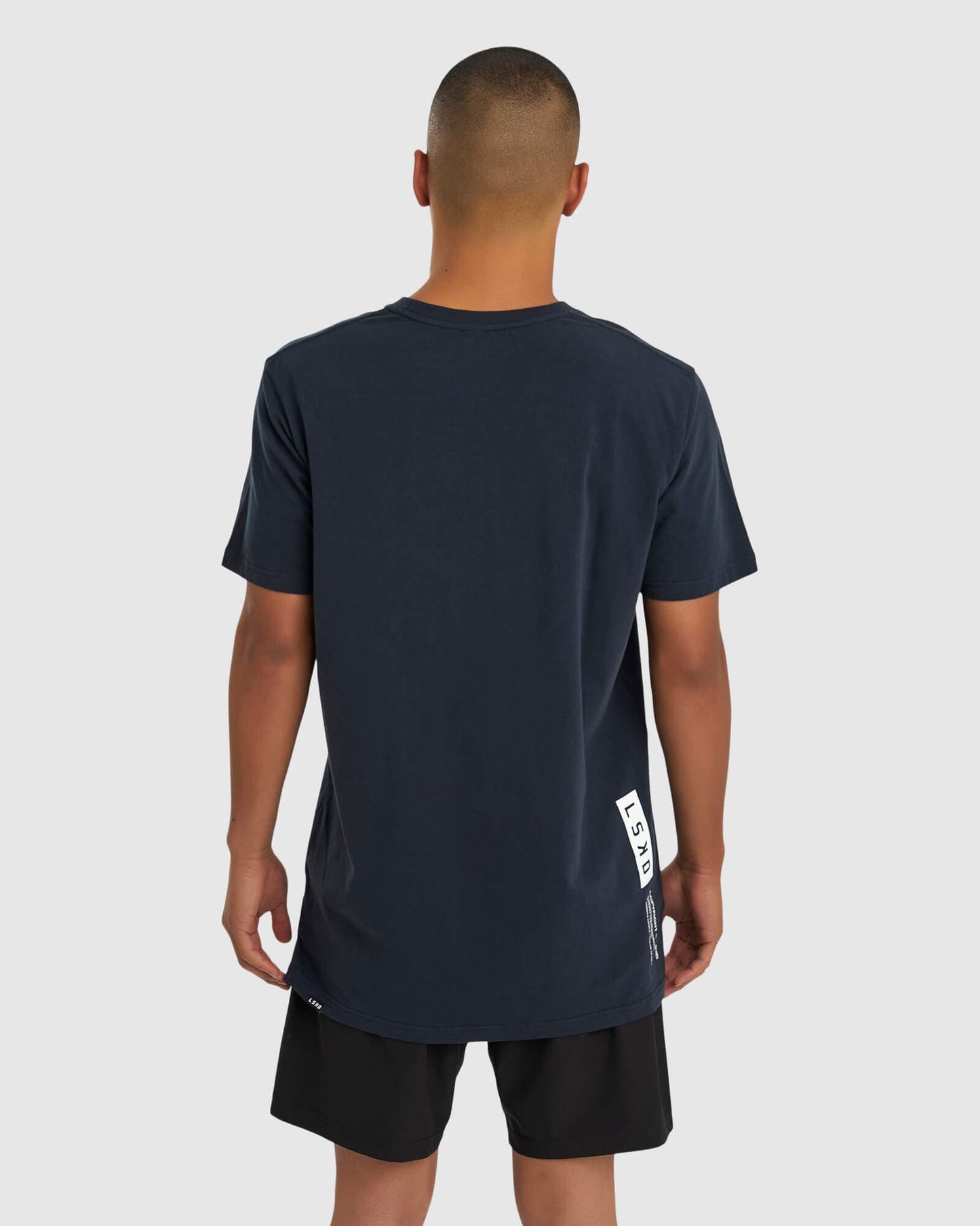 Model wearing Form Tee - Carbon