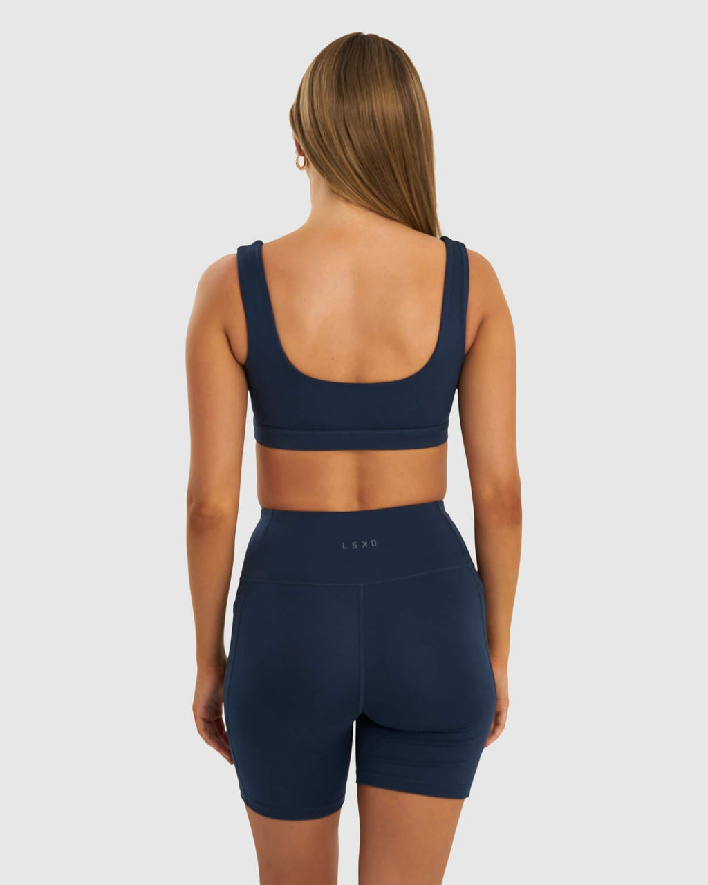 Model wearing Port Sports Bra - Carbon