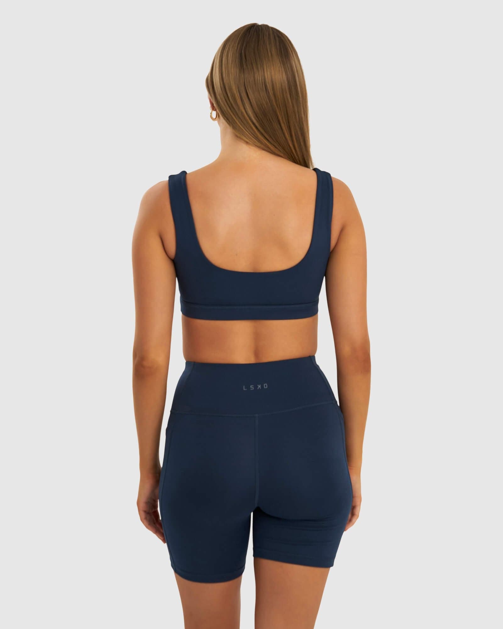 Model wearing Port Sports Bra - Carbon