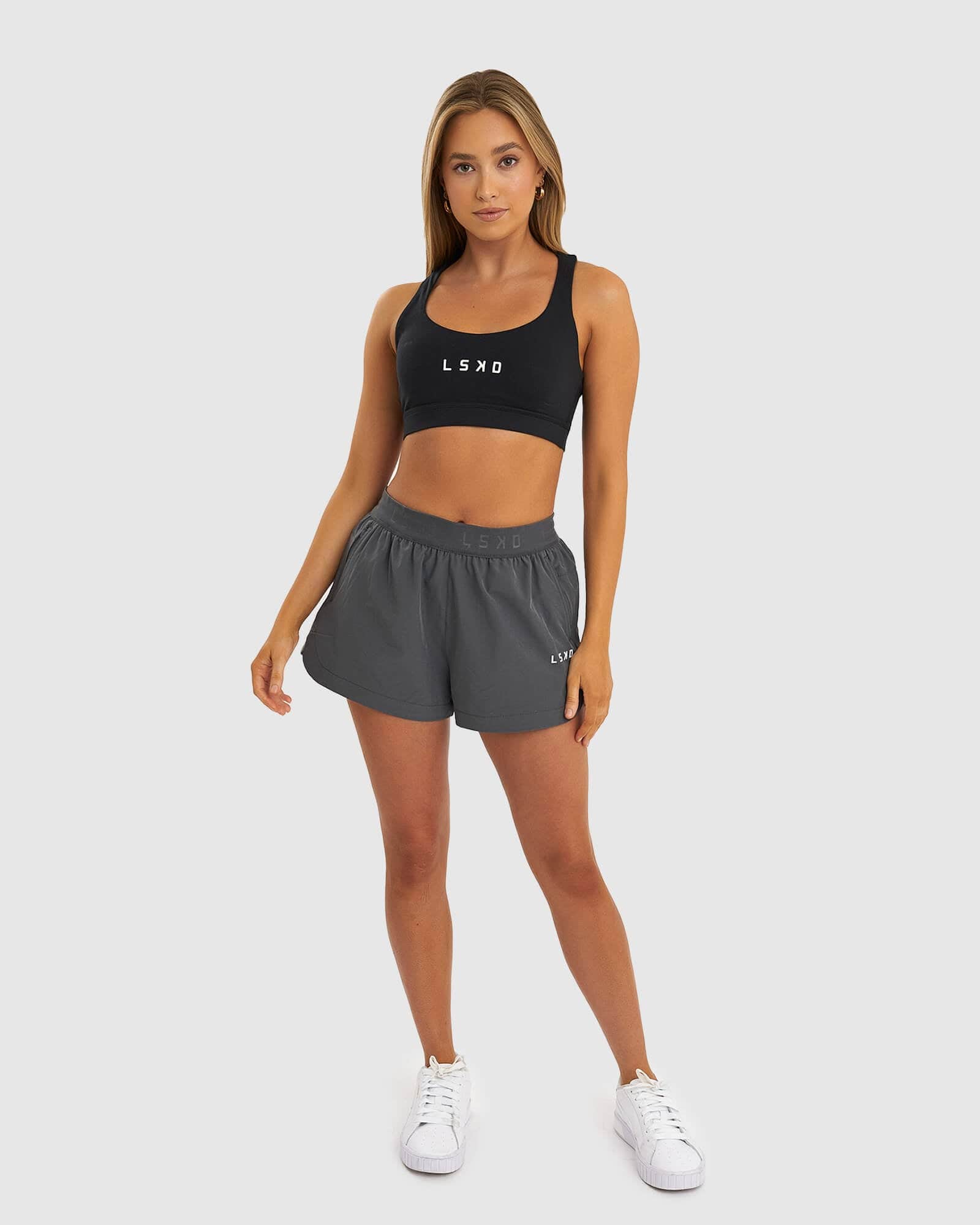 Model wearing Competition Performance Short - Iron