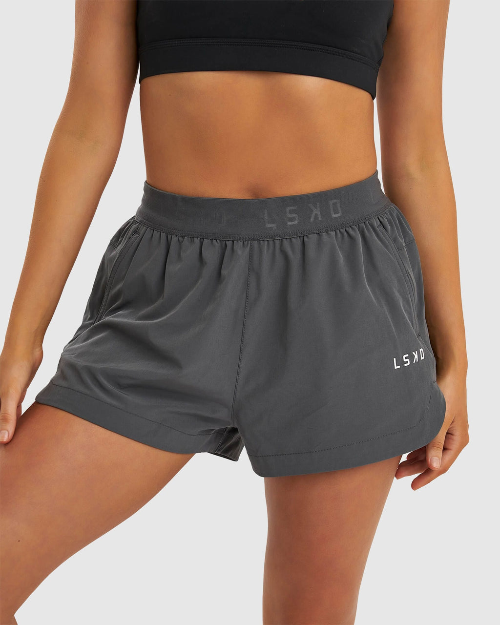 Model wearing Competition Performance Short - Iron