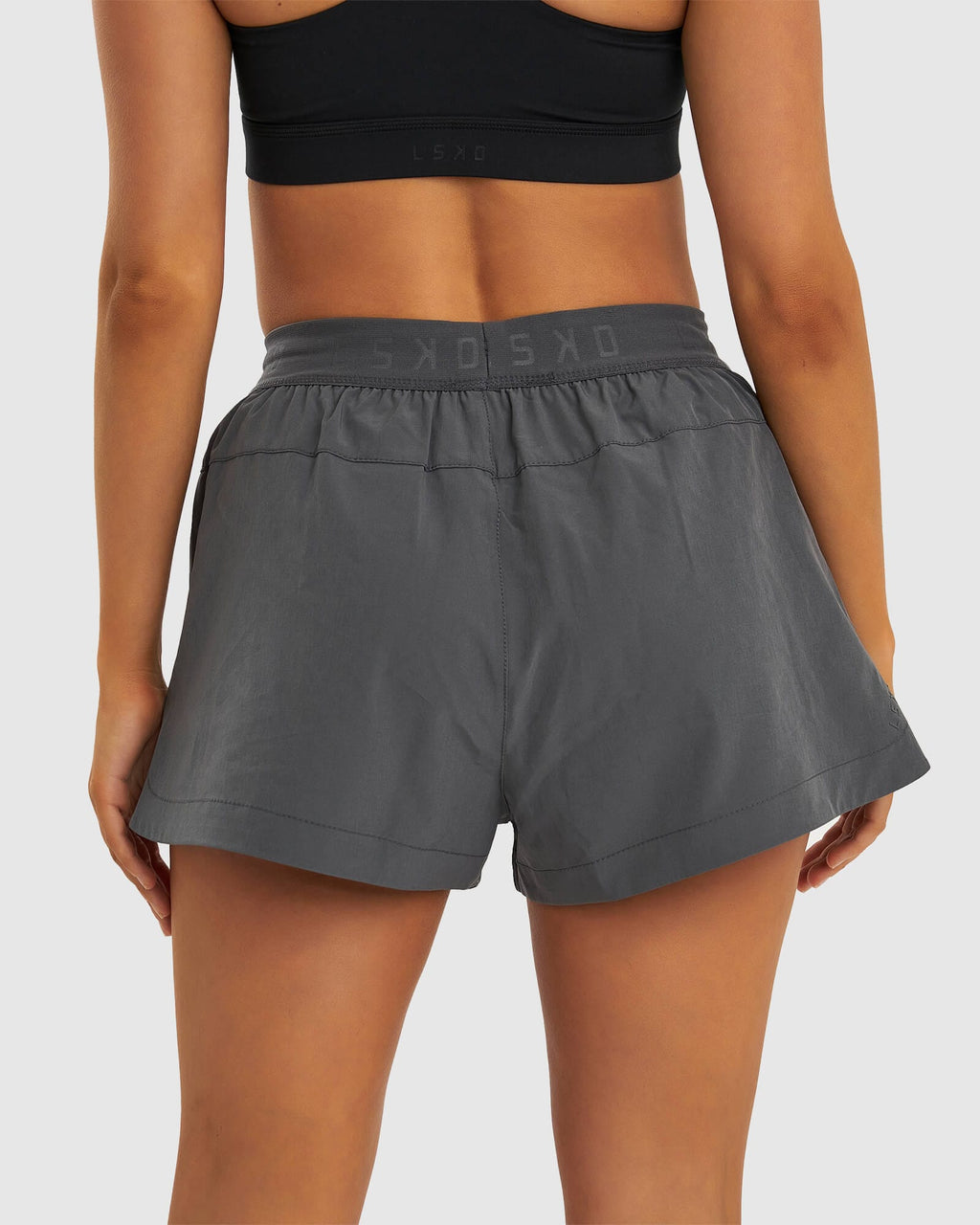 Model wearing Competition Performance Short - Iron