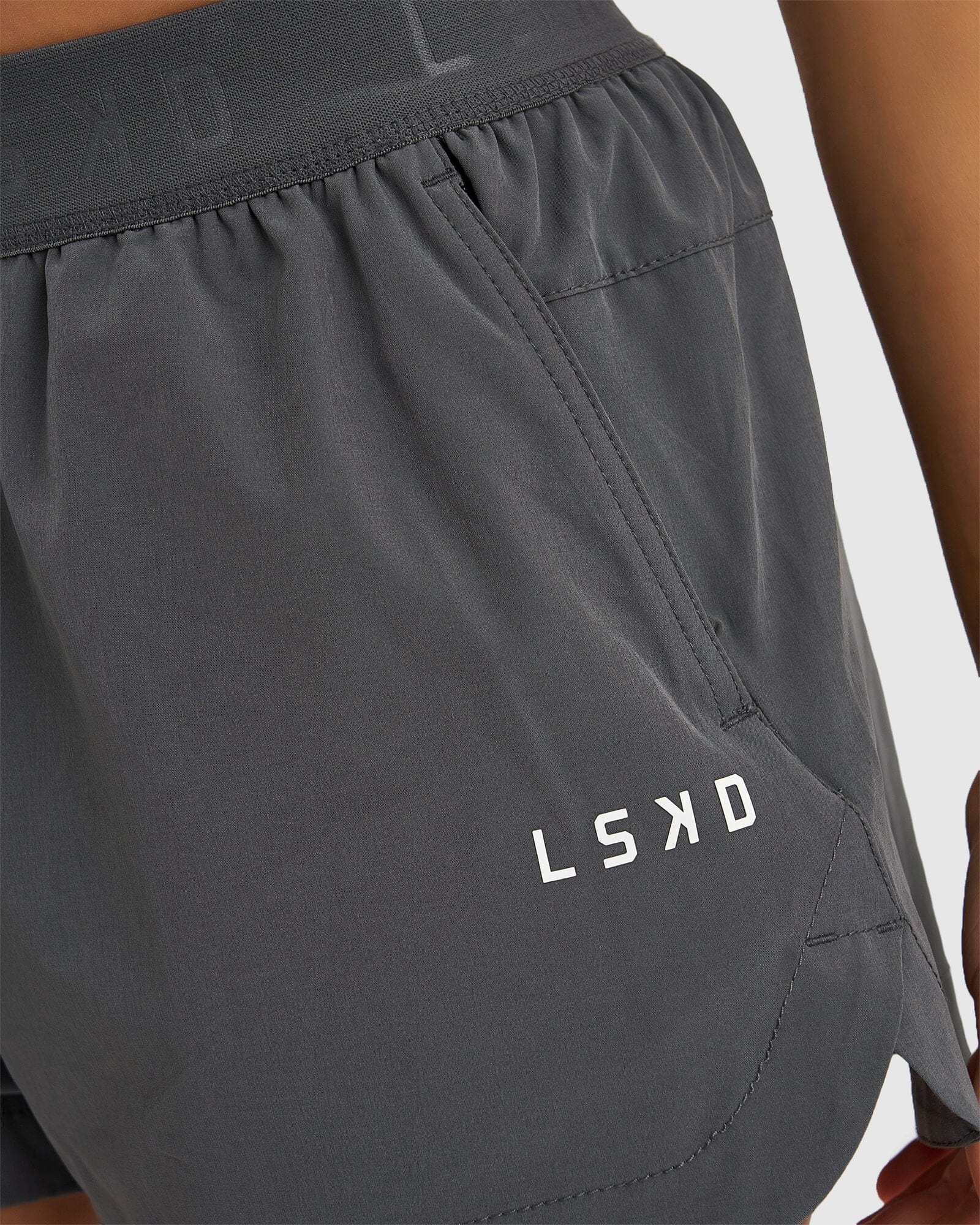 Model wearing Competition Performance Short - Iron