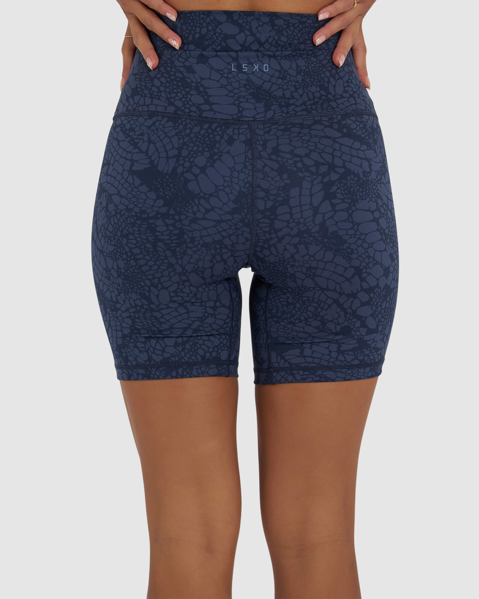 Model wearing Base Mid Short Tight - Navy Mamba