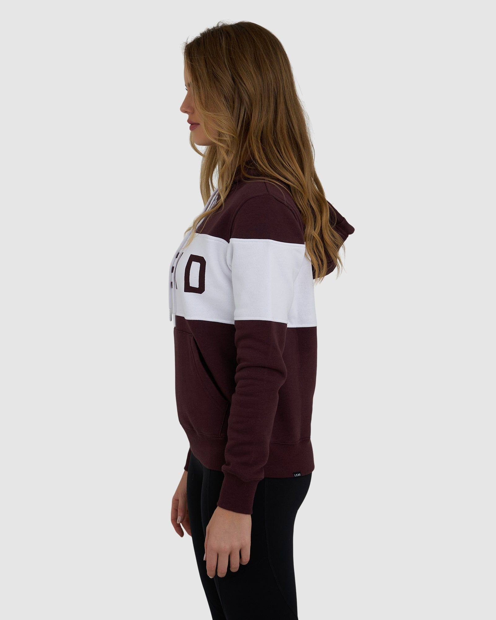 Model wearing Shape Hoodie - Fudge-White