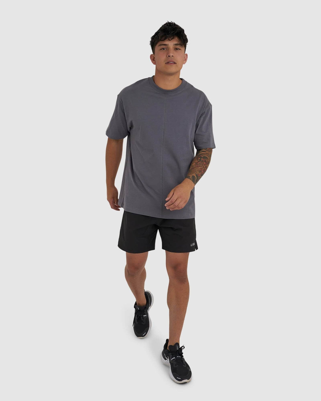 Model wearing Unisex Heavy Hitter Heavyweight Tee Oversize - Iron