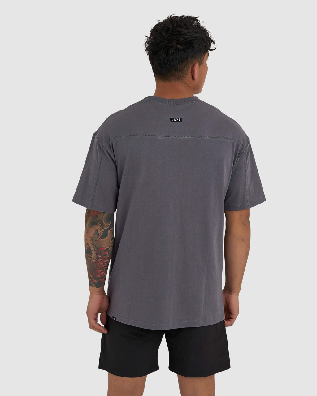Model wearing Heavy Hitter Heavyweight Tee Oversize - Iron