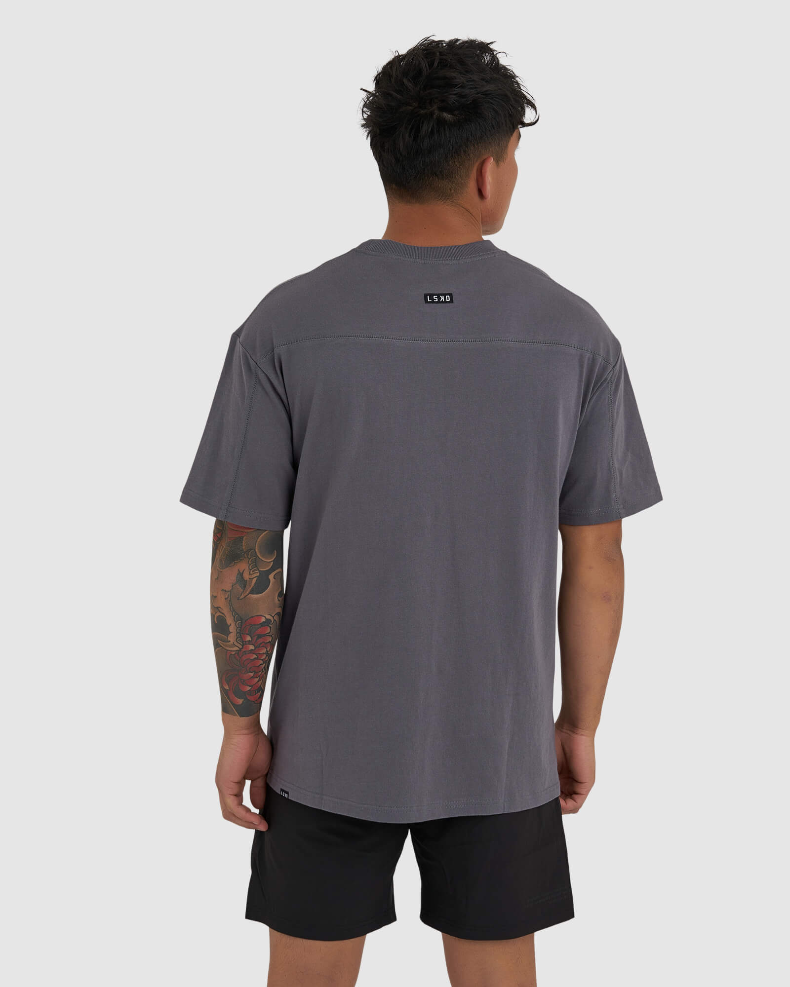 Model wearing Heavy Hitter Heavyweight Tee Oversize - Iron