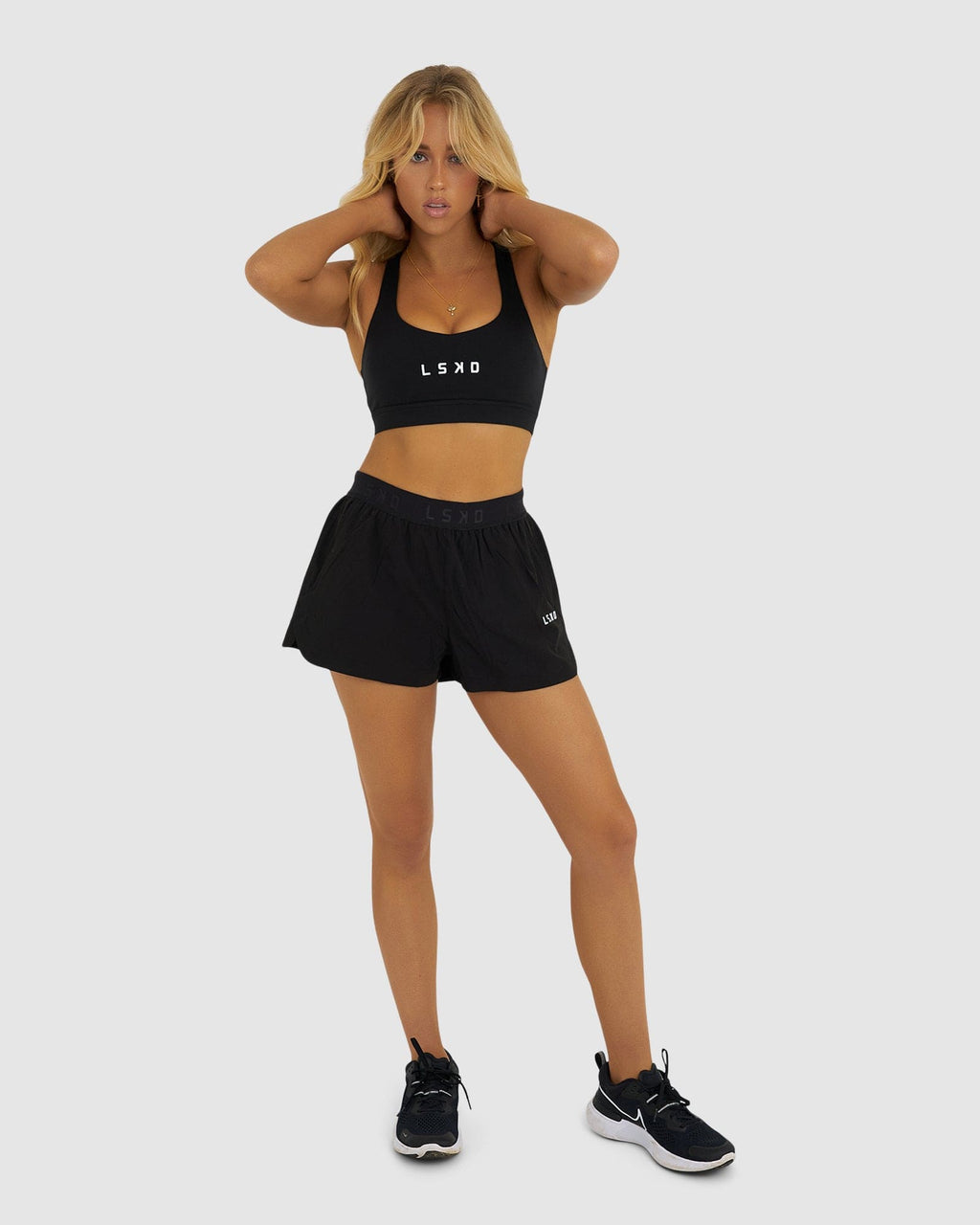 Model wearing Competition Performance Short - Black