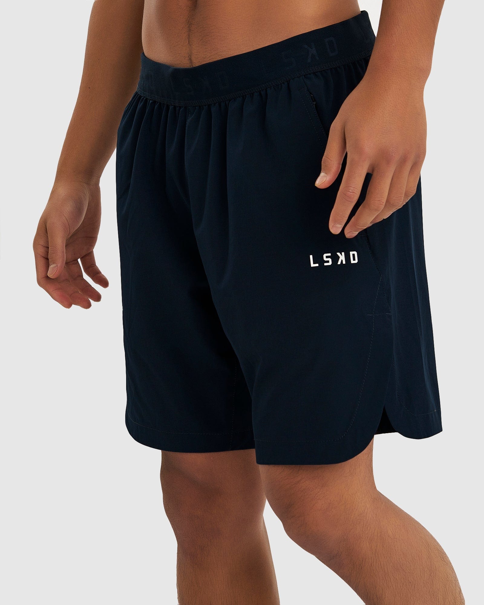 Model wearing Competition 8" Performance Short - Carbon