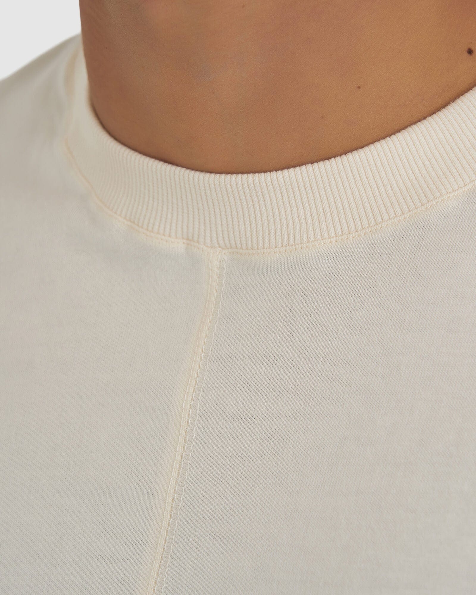 Model wearing Unisex Heavy Hitter Heavyweight Tee Oversize - Creme