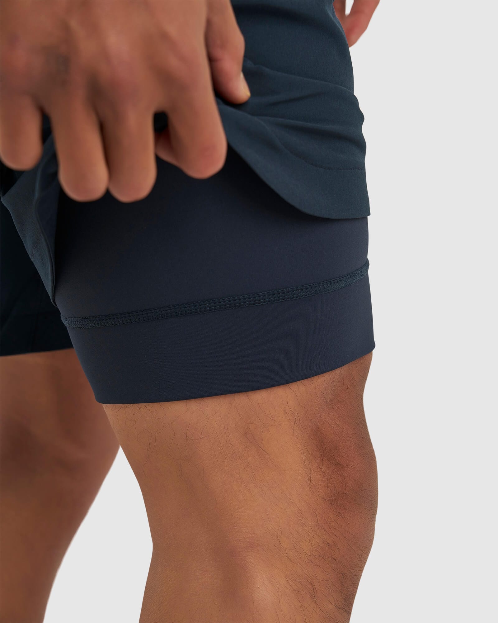 Model wearing Power 7" Performance Liner Short - Carbon