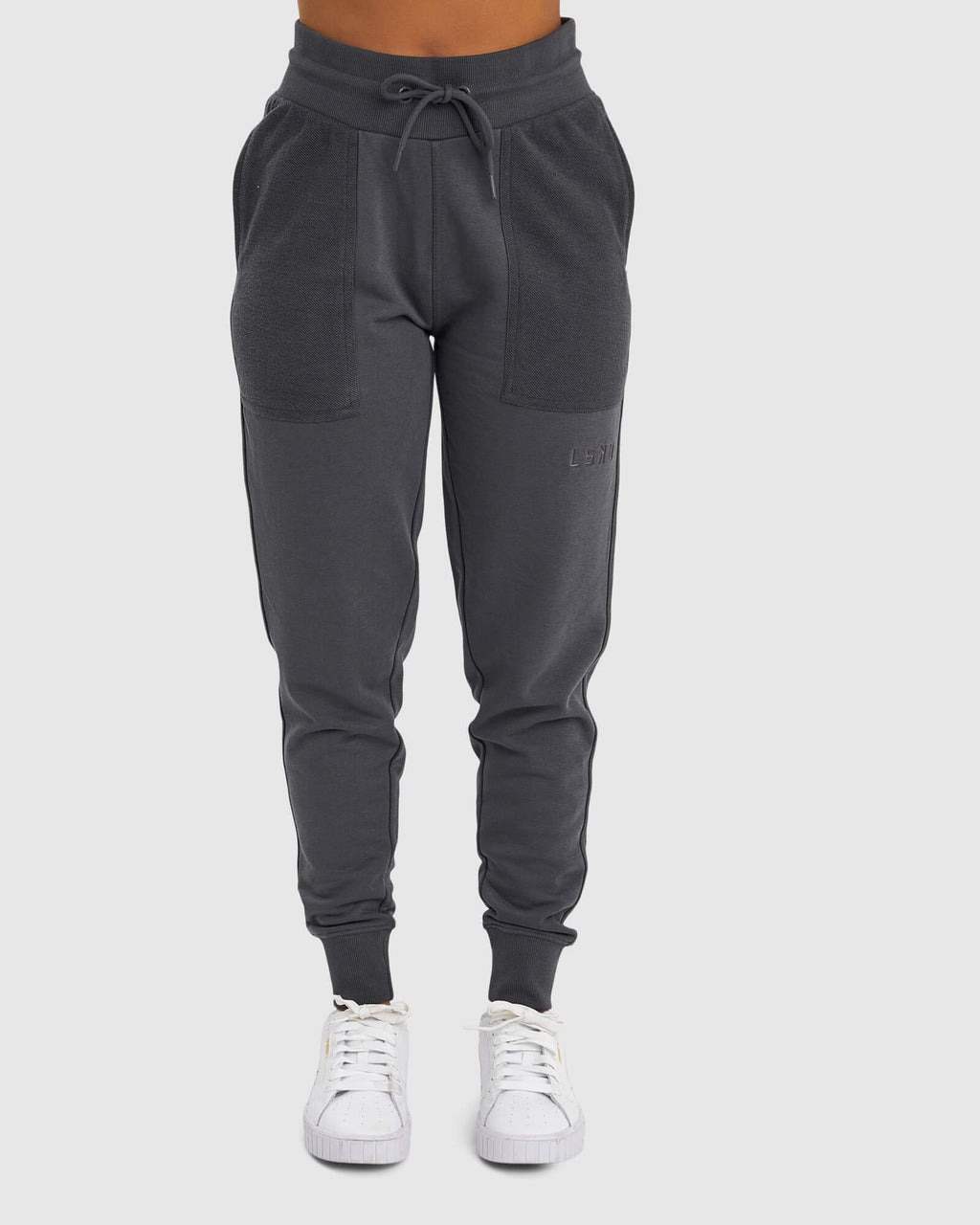Model wearing Unisex Locker Room Track Pant - Iron