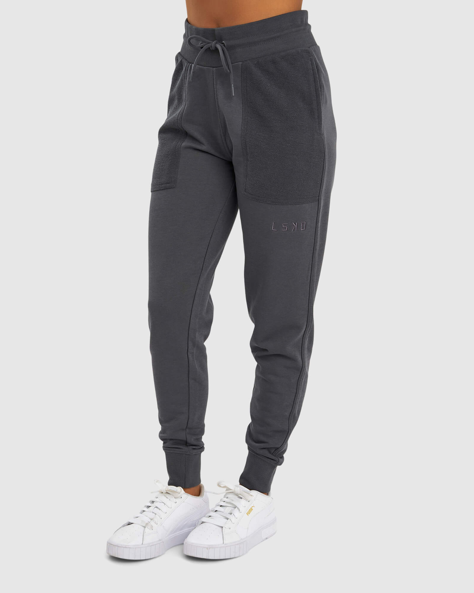 Model wearing Unisex Locker Room Track Pant - Iron