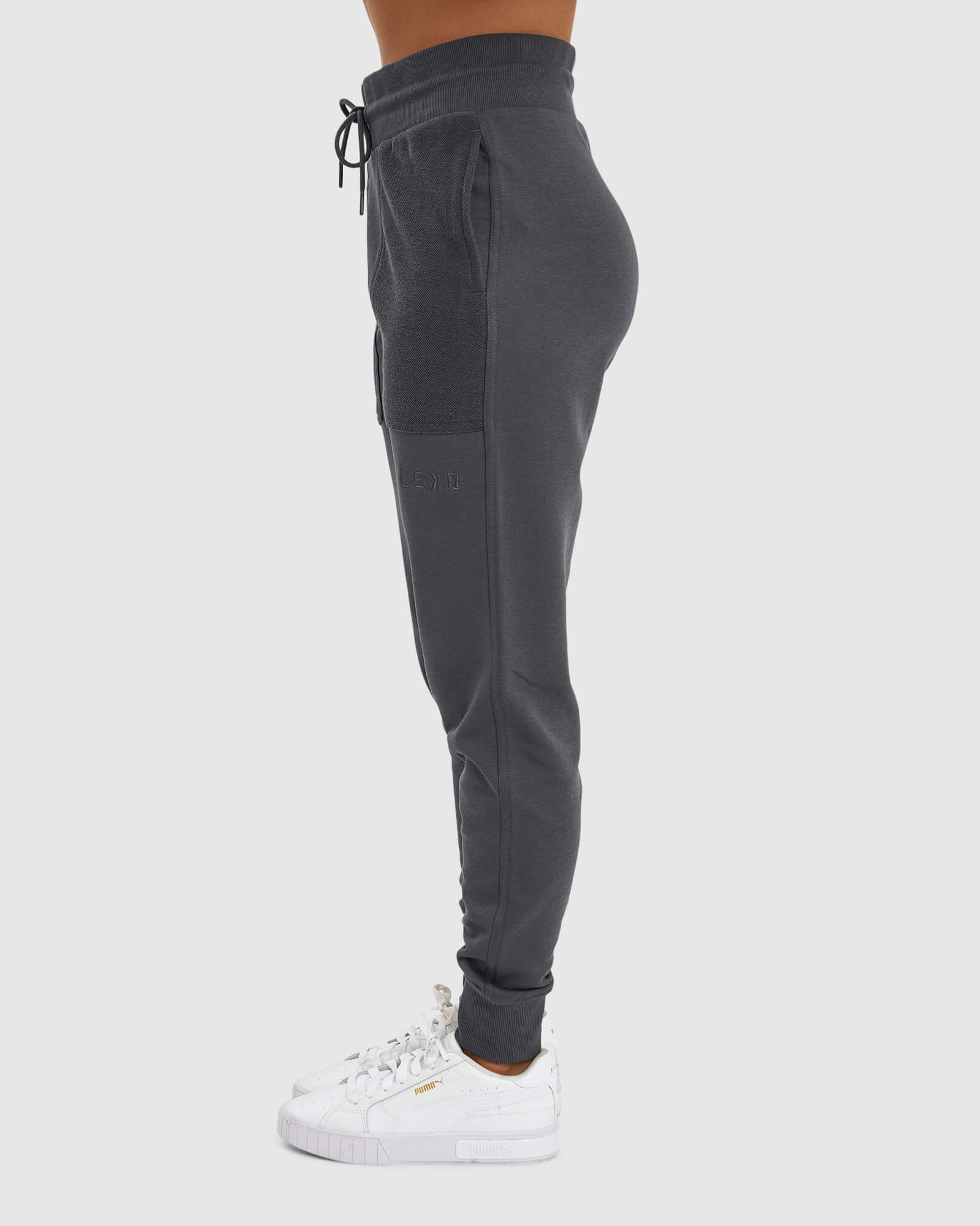 Model wearing Unisex Locker Room Track Pant - Iron