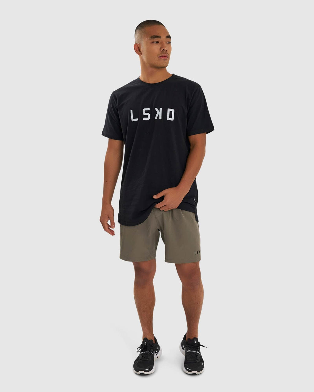 Model wearing Intensity 7" Performance Short - Walnut Grey