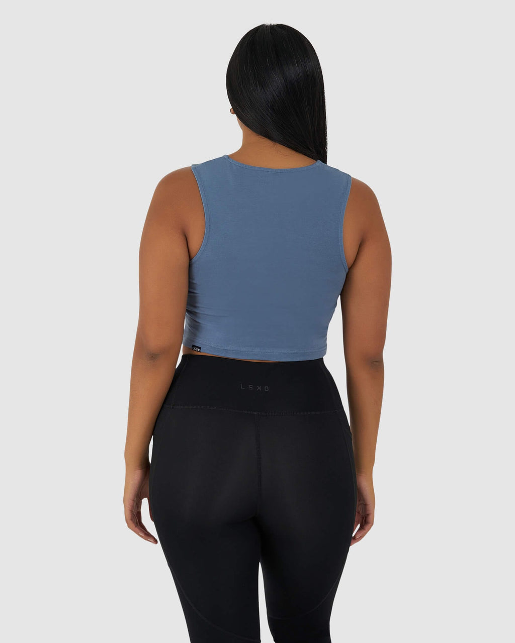 Model wearing Twist Tank - Lt Carbon